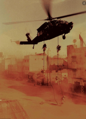 Blackhawk Down Crash Site and the Mogadishu Mile Tour A helicopter hovers over a war-torn city as soldiers rappel down ropes towards the ground, their mission unfolding amidst a dusty, tense atmosphere.
