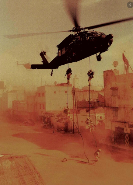 A helicopter hovers over a war-torn city as soldiers rappel down ropes towards the ground, their mission unfolding amidst a dusty, tense atmosphere.